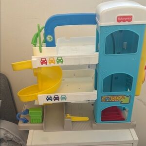 Fisher-Price Blue and Yellow Parking Garage and two cars